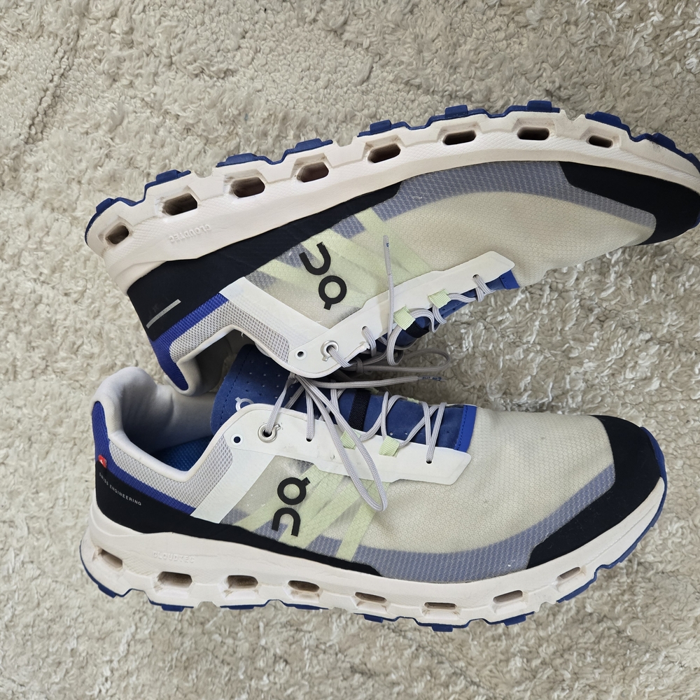 On Running White and Blue Athletic Shoes with CloudTec Cushioning